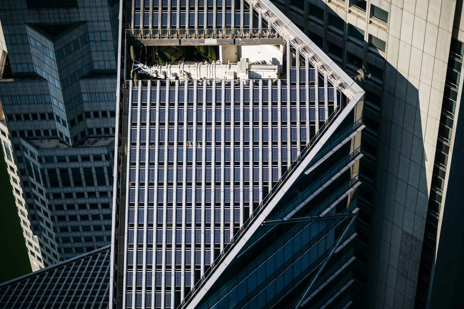 aerial view of a skyscraper roof with solar panels